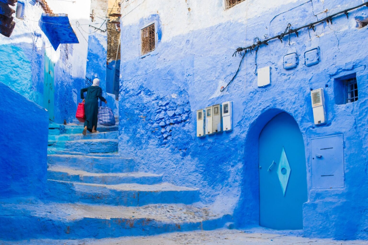 5°-DIA-CHEFCHAOUEN-narrow-street-with-blue-painted-walls-and-stairs-i-2023-11-27-04-49-28-utc-scaled