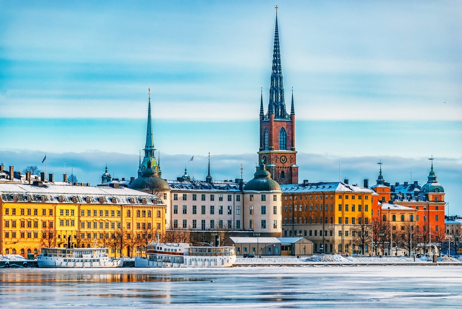 A view of Stockholm's gamla stan region from across the frozen river in winter time.