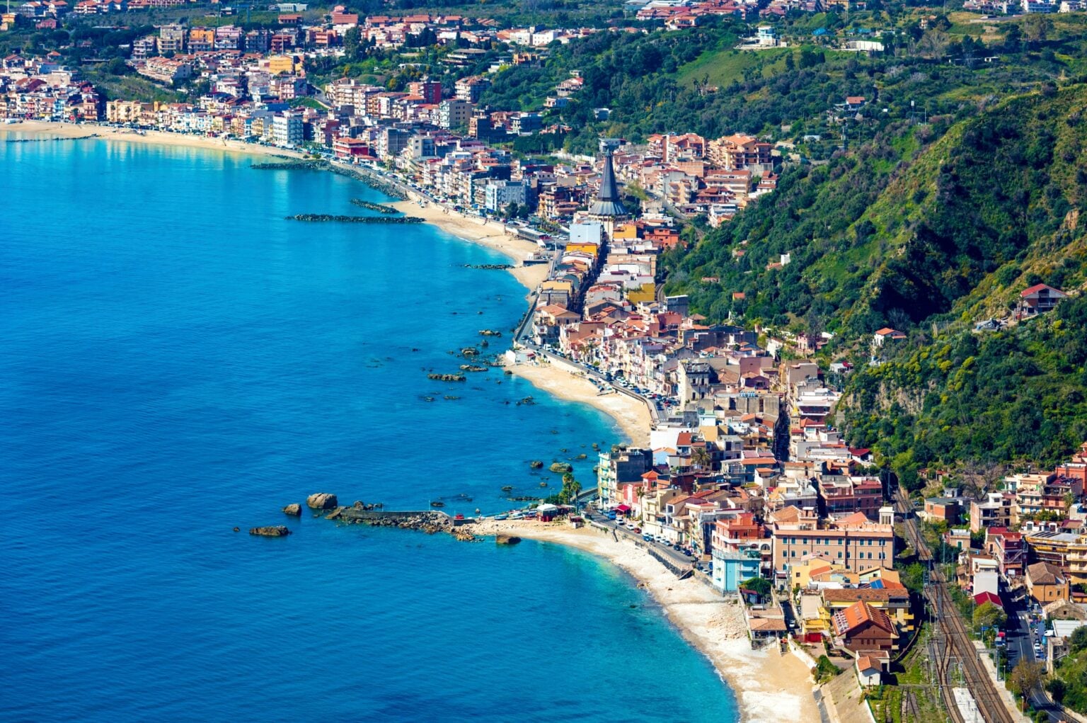 Aerial view of Giardini Naxos, comune in Messina on Sicily Island, Italy. It is situated on coast of Ionian Sea between Cape Taormina and Cape Schiso.