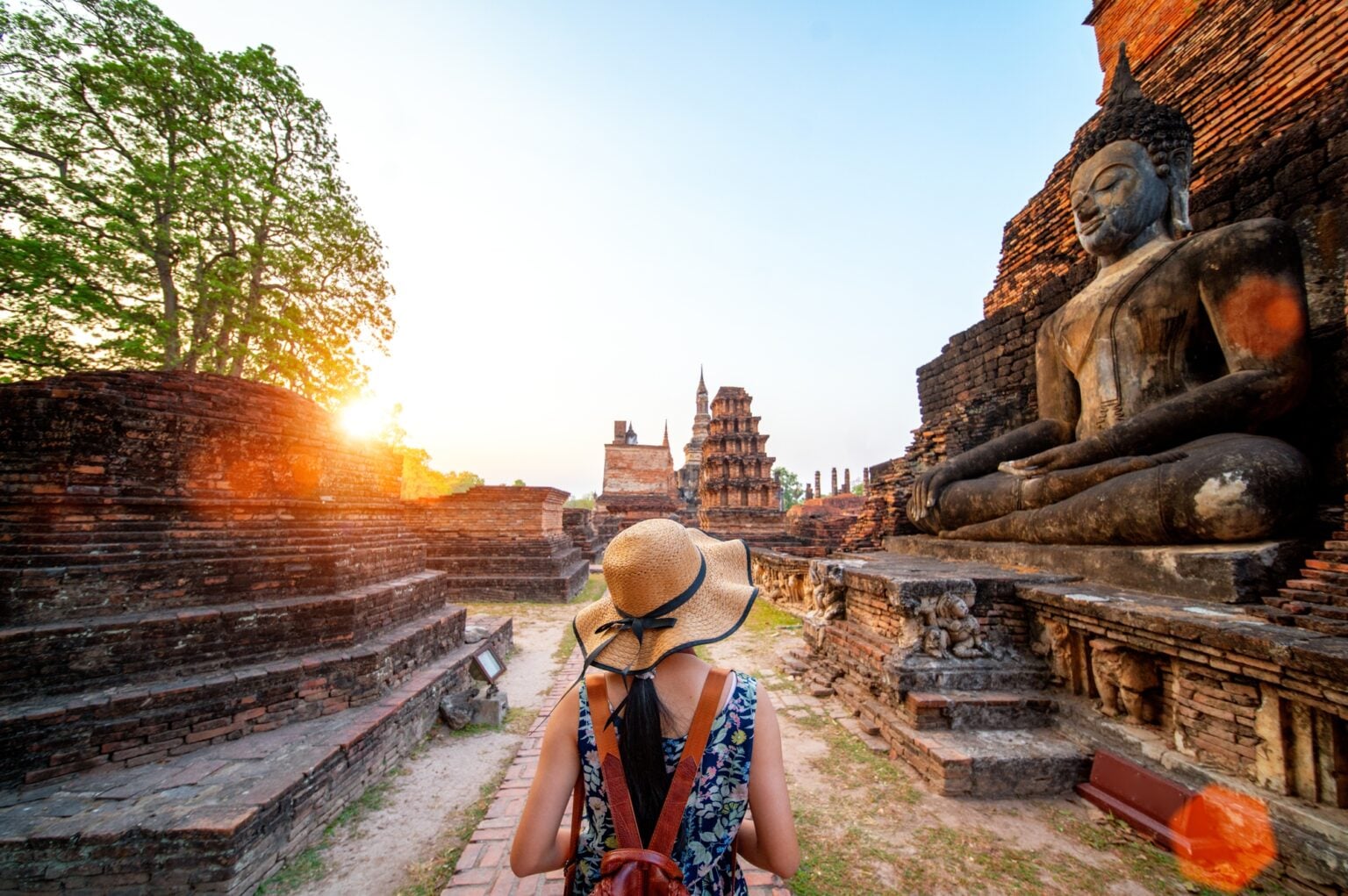 Sunset and light in Sukhothai historical park and wat Sri chum with Asian traveller walking on the temple, this image can use for travel, Bangkok, Thailand and landmark in aisa concept