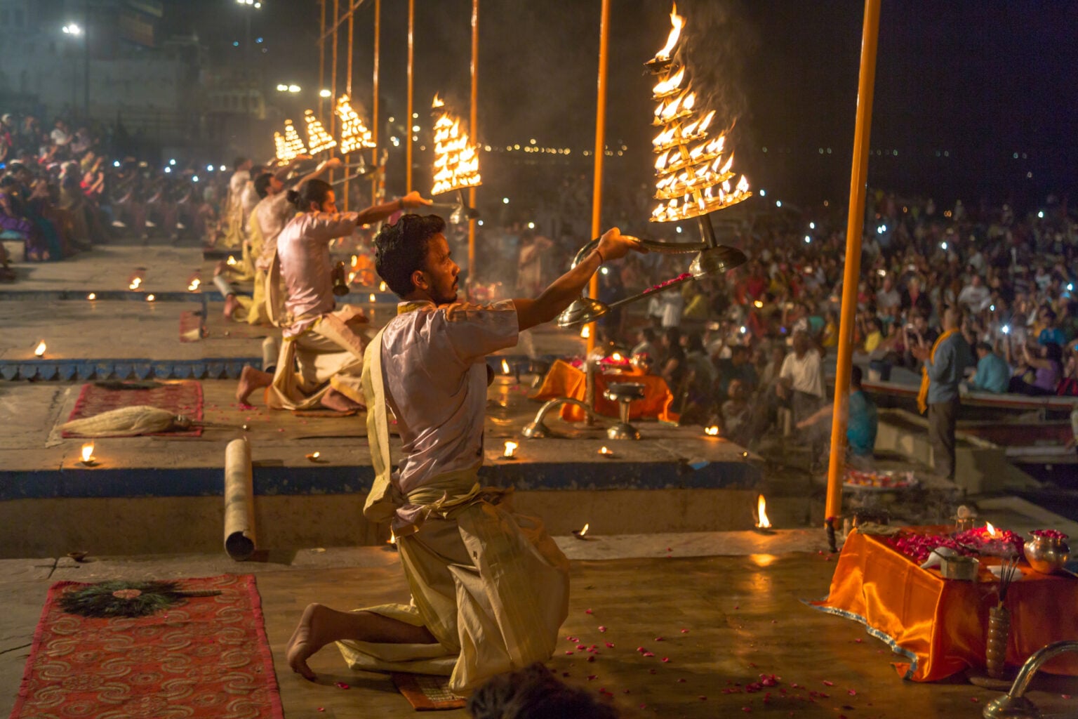 Varanasi, India, October 13,2017: Holy Ganga aarti ceremony performed by young priests amidst tourist and devotees at the Ganges river bank at Varanasi India.
