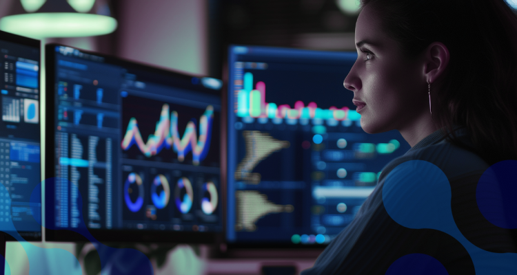 Pessoa analisando gráficos de desempenho em múltiplos monitores, focada em dados de RMM para gestão de sistemas e redes.
